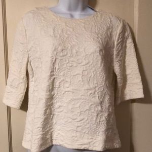 Cream top with flower decor